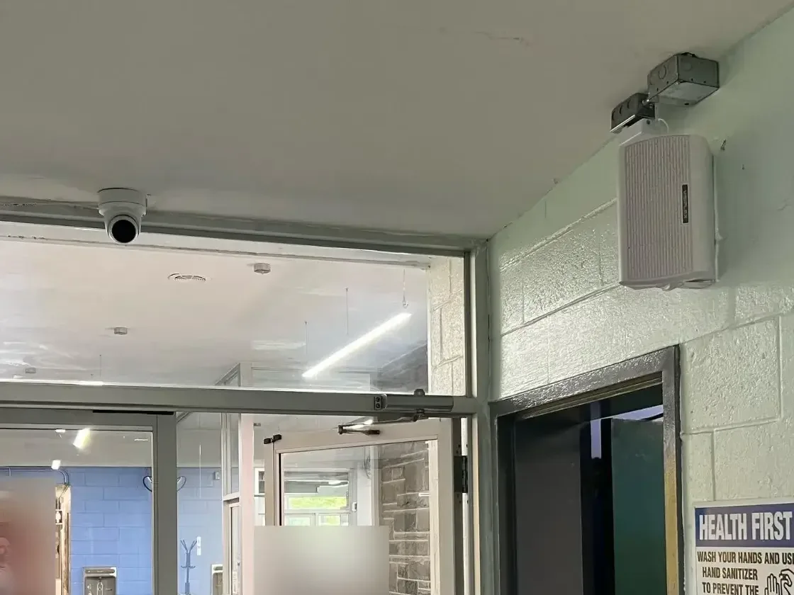 Video Surveillance Systems NYC, NJ & CT 8 Dome security camera and PA speaker at a school entrance, installed by Solved IT