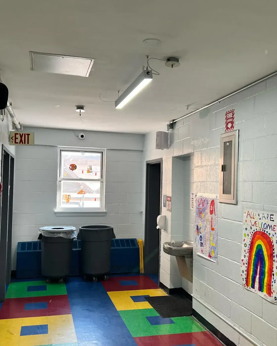School hallway at Academy of the City with a dome camera and PA speaker installed by Solved IT